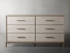 a white dresser sitting on top of a gray floor