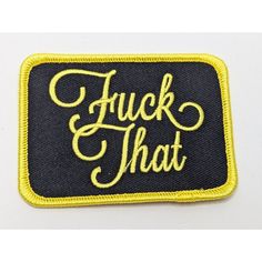 a black and yellow patch with the words f k that on it