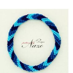 a blue beaded bracelet on a white background