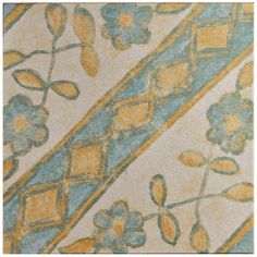 an artisticly designed rug with blue, yellow and white flowers on the bottom corner