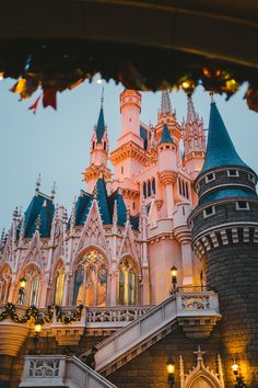 the castle is lit up with christmas lights