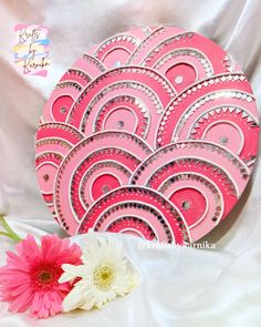 a pink heart shaped card with white and pink flowers