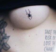 a woman with a spider tattoo on her chest