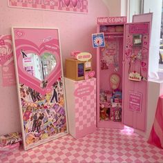 there is a pink doll house with many things in it