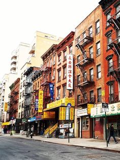 a city street with many buildings and signs