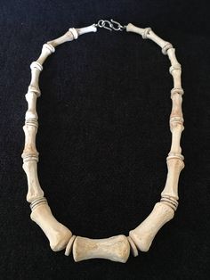 "Necklace ~ Spirit of the Wind ModernTribal Bone Chic Bone Jewelry, Sleek, light weight Artist: Teresa Bradford-Cole For those who visit Ranch grave yards, You will appreciate this collection of found bones now available to resonate and be enjoyed. One of my joys is hunting and gathering I am in my element when I am doing just that. a great find in a old ranch graveyard, like a bee with flowers xoxoox This is a ranch horse lay to rest . Tail Vertebrae, with Ostrage egg shell spacers. Length 21\" Bone Mobile, Bone Wind Chime, Emotional Capacity, Bones Jewelry, Bee With Flowers, Bones Necklace, Real Bone Jewelry, Tail Bone, Ranch Horse