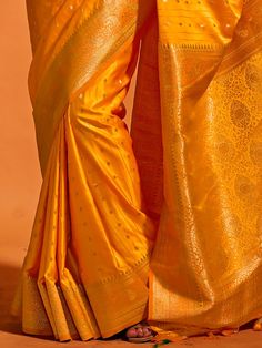 Wear this designer saree with amazing trending zari weaving work to create fashion statements. This yellow saree can be adorned at festivals and events. Made with yellow color silk material, it exudes elegance and charm. The zari weaving work adds a touch of traditional beauty to the saree, making it perfect for wedding ceremonies, cocktail parties, festivals, and marriages.
The saree comes with attached tassels, enhancing its overall appeal. The matching yellow color silk material blouse with z Yellow Saree With Cutdana Embroidery, Yellow Art Silk Blouse Piece For Navratri, Yellow Saree With Cutdana, Yellow Blouse Piece For Puja And Navratri, Yellow Saree With Cutdana For Navratri, Yellow Dola Silk Blouse Piece For Puja, Yellow Unstitched Blouse Piece For Festivals, Yellow Semi-stitched Saree For Navratri, Yellow Cutdana Blouse Piece For Festivals