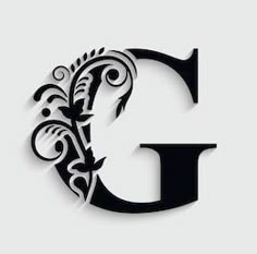 the letter g is made up of black and white floral designs on a gray background