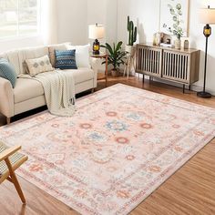 a living room filled with furniture and a large rug