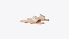 Double T Deco Sport Slide: Women's Designer Sandals | Tory Burch Luxury Slip-on Slides For Spring, Luxury Synthetic Slip-on Slides, Luxury Flat Slides With Leather Footbed, Luxury Flat Slides With Cushioned Footbed, Luxury Leather Footbed Flat Slides, Luxury Cushioned Slides Flat, Luxury Synthetic Slides, Luxury Cushioned Flat Slides, Luxury Slides With Cushioned Footbed