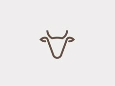 a cow's head is shown in this minimalistic logo