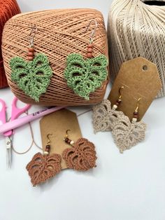 some crocheted items are laying out on the table