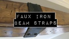 a sign that says faux iron beam straps hanging from the side of a wooden structure