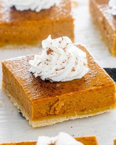 pumpkin pie bars with whipped cream on top and the title overlay reads, to cook's pumpkin pie bars