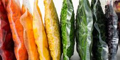 many different types of vegetables in plastic bags