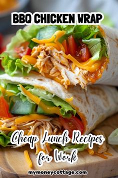 a chicken wrap with lettuce, tomatoes and cheese on it sitting on a cutting board