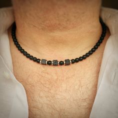 Our sophisticated Midnight Black Necklace is crafted from smooth, matt-black Grade A Agate  with three volcanic Lava beads. These highly textural, geometric beads are accented with your choice of either gold-tone or silver-tone shimmery spacer beads, with a matching chunky clasp. This stylish beaded necklace is available in various lengths (model wears 18"). This is a strong, masculine necklace, with a definite night-time vibe. It will arrive carefully wrapped in tissue paper, inside a jute pouc Holiday Necklace, Boho Men, Black Bead Necklace, Stylish Necklace, Dope Jewelry, Natural Stone Jewelry, Mens Beaded Bracelets, Lava Bead