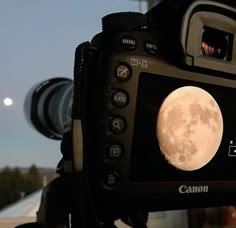 a camera with a full moon on the screen