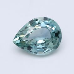 an aqua colored diamond on a white background