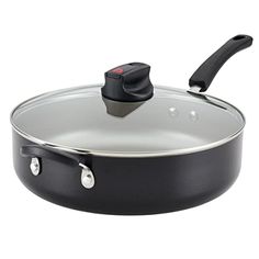 an empty pan with a lid and handle on the bottom, sitting in front of a white background