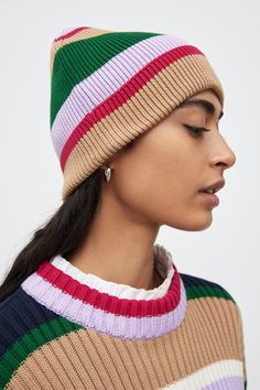 A knitted beanie with a rolled hem made from organic cotton in a playful striped rib. Ribbed Knit Beanie, Handmade Fair, Striped Beanies, Knitted Beanie, Everyday Basics, Genetically Modified, Women's Beanie, Knitted Poncho, Rolled Hem