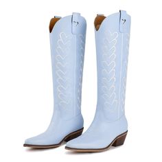 The Maybelle - our stunning baby blue boots are designed to steal hearts. The standout feature of The Maybelle is the parallel hearts running down the sides and each boot is adorned with heart-shaped cut-outs on the top pull loops. Whether you're attending a music festival, embracing a country-inspired look, or simply wanting to add a touch of romance to your everyday style, The Maybelle is the perfect choice. Material: Vegan Leather Baby Blue Boots, Stolen Heart, Blue Boots, Everyday Style, Cut Outs, Music Festival, Baby Blue, Everyday Fashion, Vegan Leather