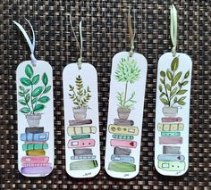 three bookmarks with plants and books on them