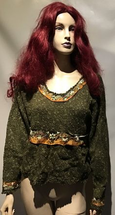 a mannequin with red hair wearing a green sweater