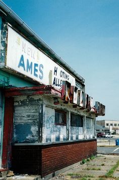 an old run down building with graffiti on it's windows and the words james h oting all over