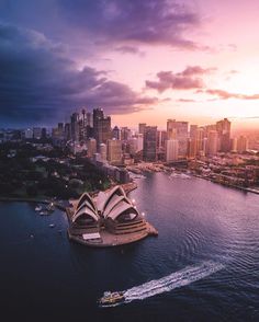 an aerial view of the sydney opera house and cityscape at sunset, australia