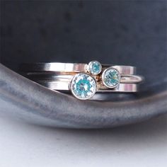 ** Order before 17th December for Christmas Delivery (UK ONLY ) ** MARCH Birthstone Ring in a stackable design. Wear one, wear a few with different sized gems, or mix with other colours of birthstones. - Silver and Aquamarine Blue Gemstone Ring - March Birthstone - Choice of gem size 2mm, 3mm or 4mm - Choice of Band style - Modern Square or fully Round options - 1.5mm wide band, made to your choice of ring size - Sterling Silver - Cubic Zirconia - Handmade in Scotland UK - Gift Boxed in a reusab Unique Blue Stackable Jewelry, Unique Stackable Blue Rings, Stackable Round Topaz Ring As Gift, Stackable Round Topaz Ring For Anniversary, Anniversary Stackable Topaz Ring, Adjustable Stackable Rings With Stone Setting, Silver Stackable Rings With Birthstones, Unique Stackable Rings With Bezel Setting For Anniversary, Unique Bezel Set Stackable Anniversary Rings