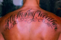 the back of a man with his name tattooed on it