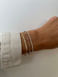 "Dainty beaded pavé bracelet is super chic & minimalist! Looks great paired with other bracelets or by itself!  Matching Necklace available! https://www.etsy.com/listing/1222967305/dainty-beaded-necklace-dainty-necklace?click_key=275df650b1d8bc35479987c32a32d3a1c42533c2%3A1222967305&click_sum=62015218&ref=shop_home_active_16&pro=1&sts=1 - - - D E T A I L S - - -  * Made of 925 Sterling Silver * We use a THICK, DURABLE plating of 14k Gold or Rhodium - for a piece that will be with you for years to come!  * Available in sizes 5.5\", 6.25\", and 6.75\" + .5\" Extension Chain * Lobster Clasp Closure * Nickel-free & Hypoallergenic  * Made of highest grade cz's for an authentic sapphire look! * Also available in Ruby, Emerald, or Diamond  RUBY https://www.etsy.com/listing/1209067278/beaded-brace Cheap Dainty Beaded Bracelets For Party, Affordable Dainty Beaded Charm Bracelet, Luxury Minimalist Gold Stackable Bracelet, Cheap Minimalist Stackable Bracelets, Dainty Gold Bracelet For Everyday Luxury, Luxury Dainty Stackable Bracelets, Dainty Stackable Jewelry At Affordable Price, Dainty Bracelets Simple & Dainty Jewelry, Cheap Minimalist Beaded Bracelets For Everyday Wear