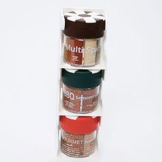 three spice jars stacked on top of each other