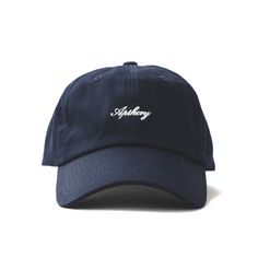 Elevate your style this summer with our Script Logo Hat! Navy dad hat features a contrasting white APTHCRY® embroidery on the front panel with an adjustable strap back. One size fits most. Adjustable Strap back Embroidery Logo Mid Profile Cap Product Photography, Cool Hat Designs, Aesthetic Hats, Minimalist Hat, Navy Ball, Cap Store, Racquet Club, Christian Hats, Wife Style