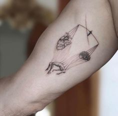 a woman's arm with some drawings on it and an arrow in the middle