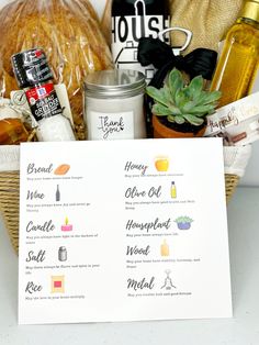 a basket filled with bread, wine and other items for a brunch or tea party