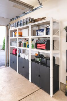 an organized garage storage area with shelves and bins