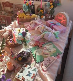 a table covered with lots of cards and flowers