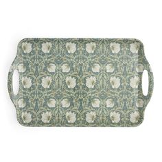 an ornate green and white serving tray with flowers on it's sides, set against a white background