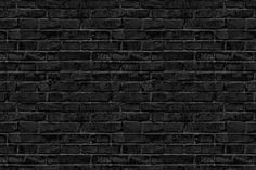 a black brick wall that is very dark