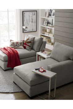 a living room with two couches and a coffee table