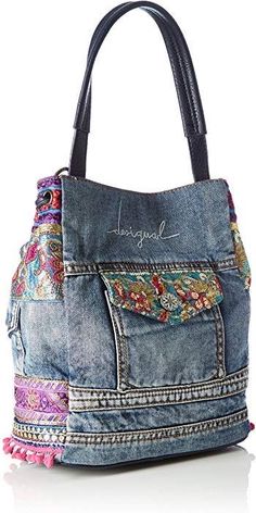 a handbag made out of old jeans with colorful patches and fringes on it