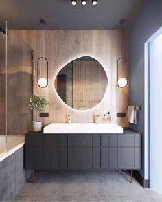 a bathroom with a sink, mirror and bathtub in the middle of it's walls