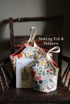 two bags sitting on top of a chair with the words sewing kit and pattern in front of them