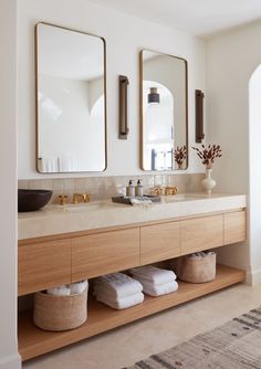 a bathroom with two sinks and mirrors on the wall next to it is instagram