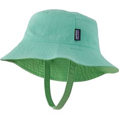 We plop the Patagonia Baby Sun Bucket Hat on our little one's head to get them ready for sun-filled adventures. This reversible hat has a full-wrap brim for total sun protection and a chin strap with hook-and-loop closure to keep it on our little one's head. Casual Bucket Hat With Upf 50+ For Playtime, Casual Upf 50+ Bucket Hat For Playtime, Green Reversible Bucket Hat For Outdoor, Adjustable Reversible Sun Hat For Outdoor, Green Sun Hat With Upf 50+ And Adjustable Fit, Green Sun Hat For Summer Camping, Adjustable Green Hat For Playtime, Green Curved Brim Sun Hat For Camping, Green Upf 50+ Camping Hat