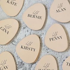 six wooden coasters with names on them sitting next to each other in the shape of hearts