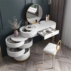 a dressing table with three drawers and a mirror on the wall next to a chair