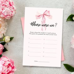 there is a card with the words where were we? on it and pink flowers